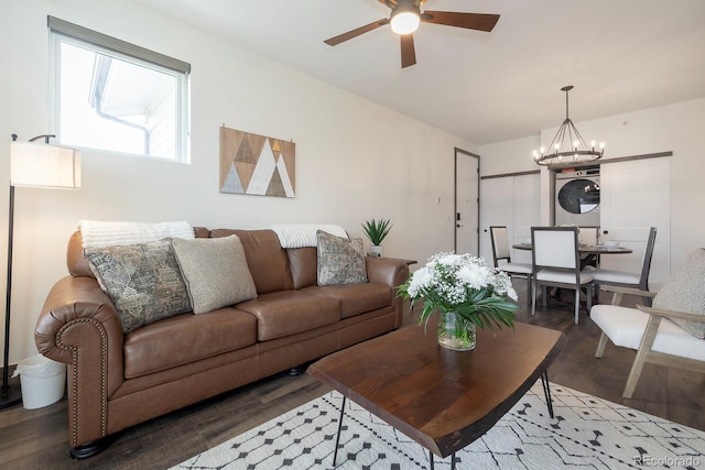 361 Gcr 840 Unit 3, Fraser, CO 80442 - living area featuring stacked washer / dryer, wood finished floors, a ceiling fan, and a chandelier