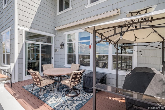 7692 Weaver Cir, Castle Rock, CO 80104 - deck with outdoor dining space and a gazebo