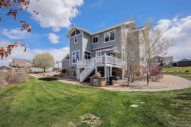 7692 Weaver Cir, Castle Rock, CO 80104 - rear view of property featuring a deck, stairway, a lawn, and a patio