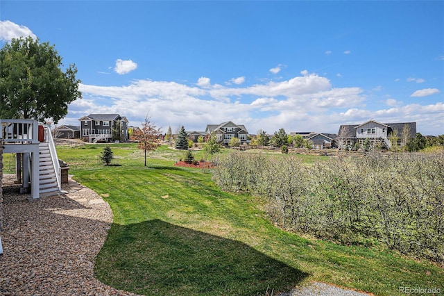 7692 Weaver Cir, Castle Rock, CO 80104 - view of grassy yard featuring stairway and a residential view