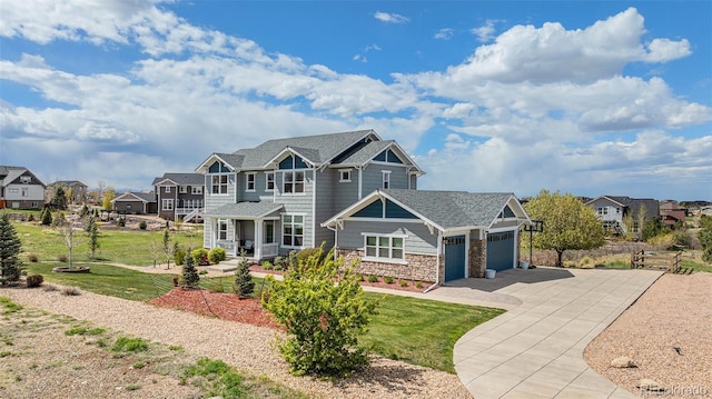 7692 Weaver Cir, Castle Rock, CO 80104 - view of front of home with driveway, a garage, stone siding, a front yard, and a residential view
