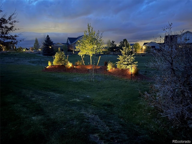 7692 Weaver Cir, Castle Rock, CO 80104 - yard at dusk with a lawn