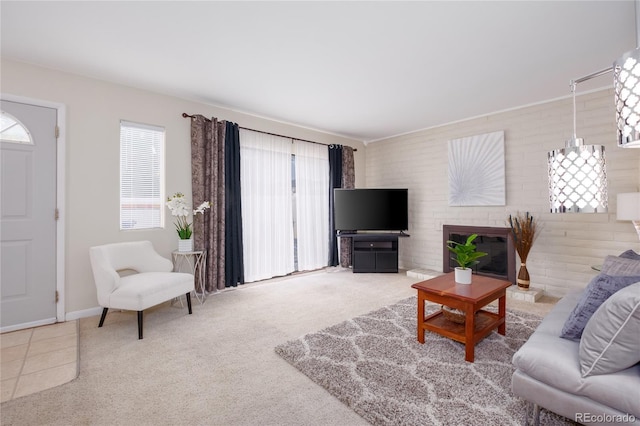 9675 E Kansas Cir Unit 48, Denver, CO 80247 - carpeted living room with healthy amount of natural light and a brick fireplace