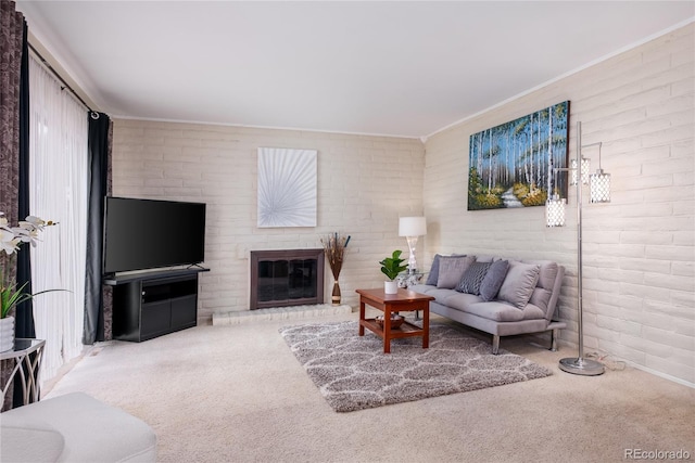 9675 E Kansas Cir Unit 48, Denver, CO 80247 - carpeted living area featuring a brick fireplace, ornamental molding, and brick wall