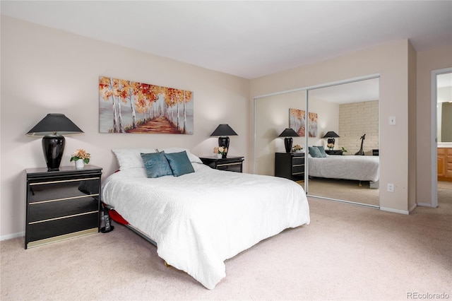 9675 E Kansas Cir Unit 48, Denver, CO 80247 - bedroom featuring carpet floors and a closet