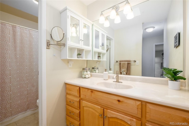 9675 E Kansas Cir Unit 48, Denver, CO 80247 - bathroom with vanity, tile patterned floors, and a shower with shower curtain