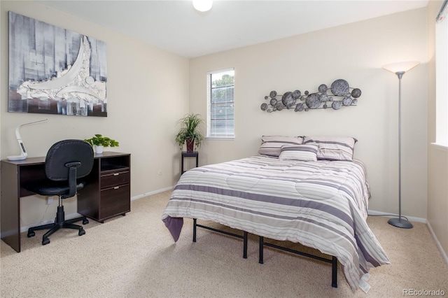 9675 E Kansas Cir Unit 48, Denver, CO 80247 - carpeted bedroom featuring baseboards and a desk