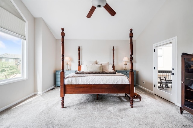 7038 Russell Ct, Arvada, CO 80007 - carpeted bedroom with multiple windows, baseboards, ceiling fan, vaulted ceiling, and access to outside