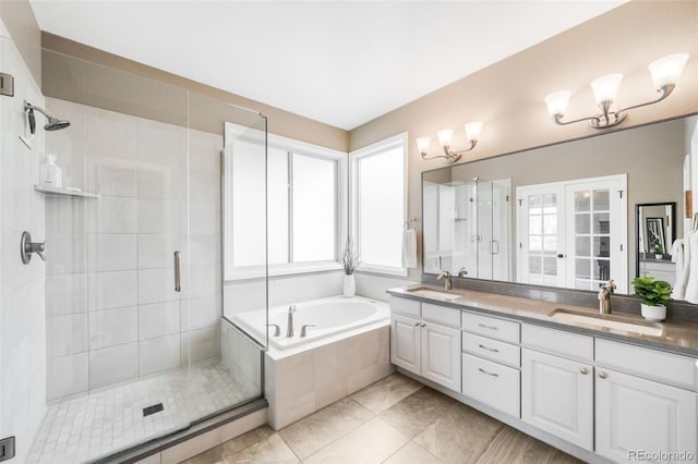 7038 Russell Ct, Arvada, CO 80007 - full bath featuring double vanity, a stall shower, a garden tub, and tile patterned flooring