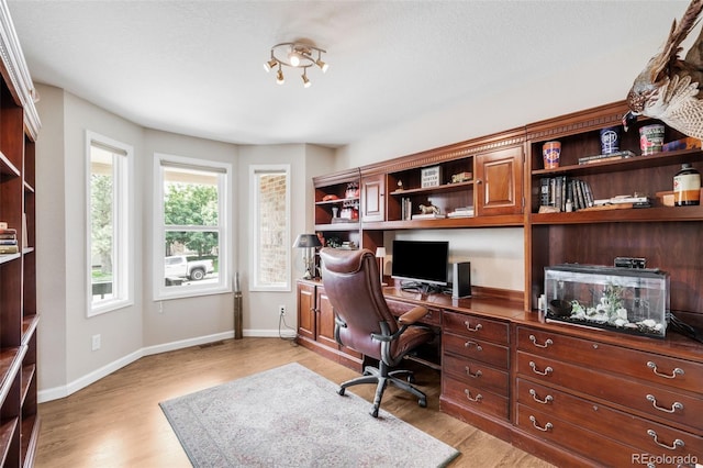 7038 Russell Ct, Arvada, CO 80007 - office space with light wood-style floors, baseboards, and built in desk