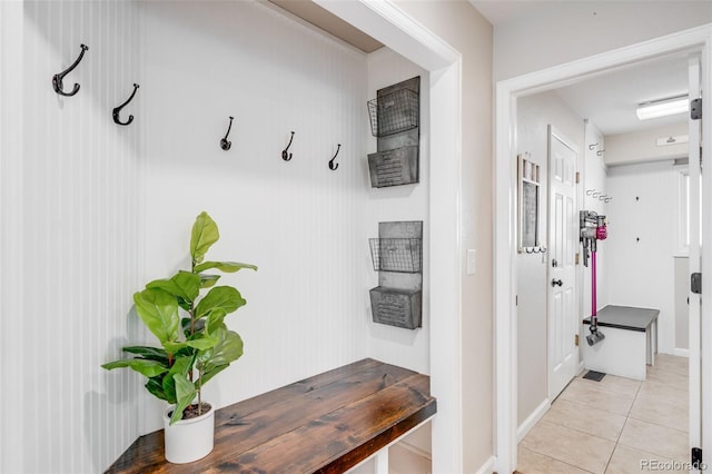 7038 Russell Ct, Arvada, CO 80007 - mudroom featuring light tile patterned floors and baseboards