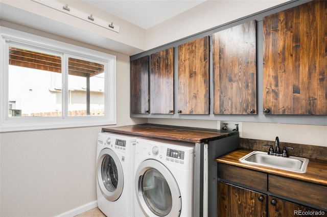 7038 Russell Ct, Arvada, CO 80007 - washroom with independent washer and dryer, cabinet space, and baseboards