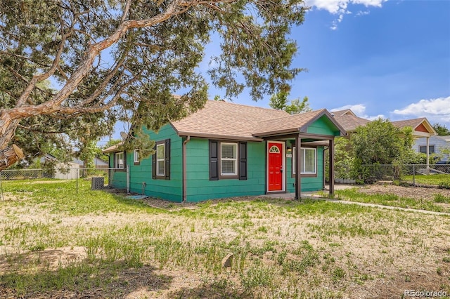 4730 S Huron St, Englewood, CO 80110 - view of front of property with roof with shingles and a fenced backyard