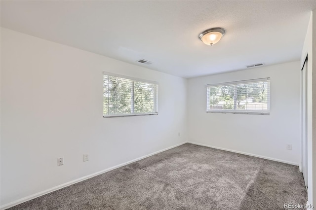 4730 S Huron St, Englewood, CO 80110 - unfurnished room featuring plenty of natural light and carpet