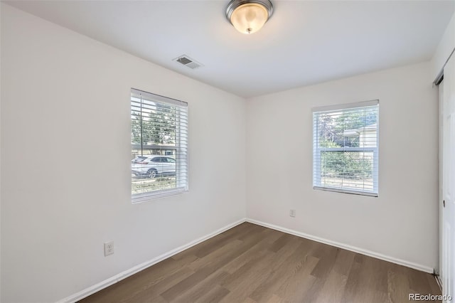 4730 S Huron St, Englewood, CO 80110 - unfurnished room with dark wood finished floors and baseboards