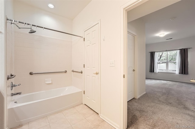 bathroom with tile patterned flooring and tiled shower / bath