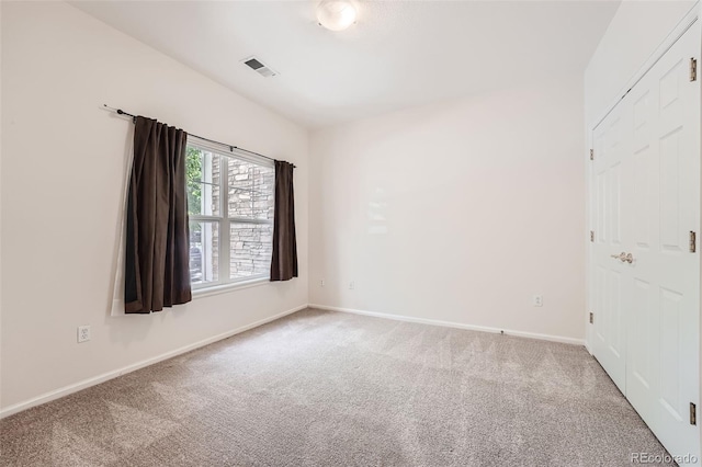 spare room featuring carpet floors