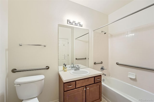 full bathroom with tiled shower / bath combo, vanity, and toilet