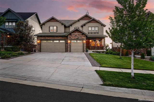 7949 S Elk Way, Aurora, CO 80016 - craftsman-style house with a garage, concrete driveway, stone siding, and a porch