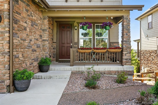 7949 S Elk Way, Aurora, CO 80016 - entrance to property with a porch and stone siding