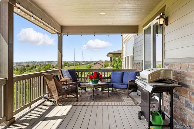 7949 S Elk Way, Aurora, CO 80016 - wooden deck featuring an outdoor living space and area for grilling