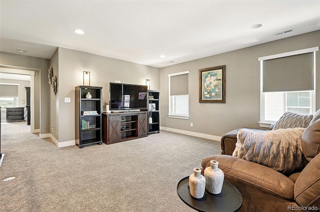 7949 S Elk Way, Aurora, CO 80016 - living room with light carpet, healthy amount of natural light, and recessed lighting