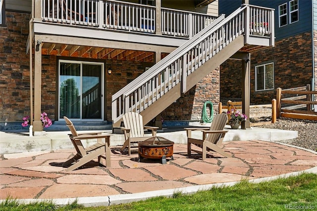 7949 S Elk Way, Aurora, CO 80016 - patio / terrace with an outdoor fire pit, a patio area, and stairway