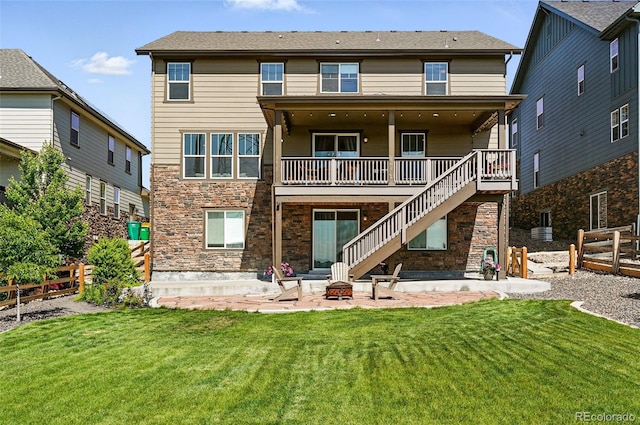 7949 S Elk Way, Aurora, CO 80016 - rear view of house featuring an outdoor fire pit, a patio, stairs, stone siding, and a deck