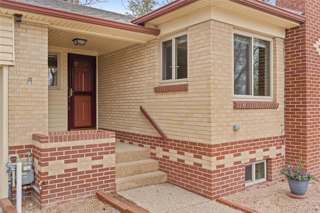 entrance to property with brick siding