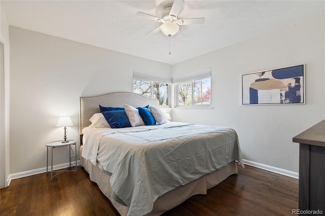 bedroom featuring baseboards, a ceiling fan, and wood finished floors
