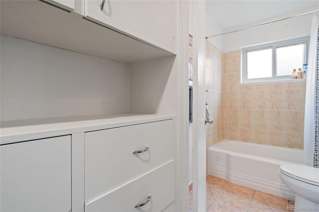 bathroom with toilet, tile patterned floors, and shower / bath combination