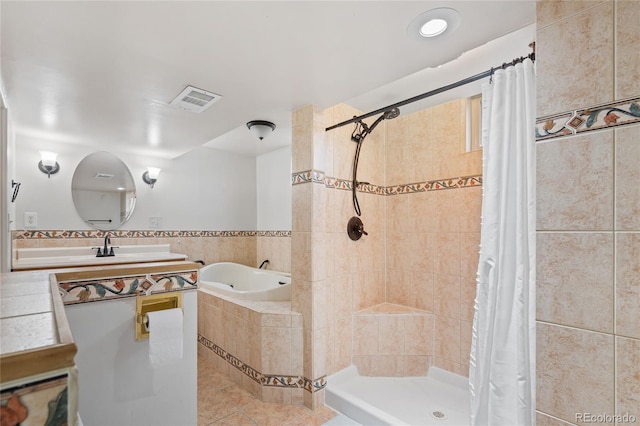 bathroom featuring tile patterned flooring, visible vents, vanity, a bath, and tiled shower