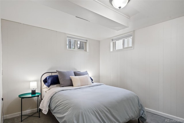 bedroom featuring baseboards and carpet floors