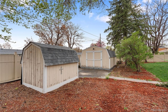 view of shed with fence