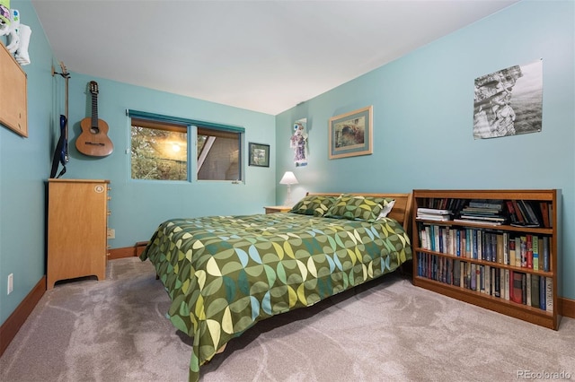 carpeted bedroom with baseboards