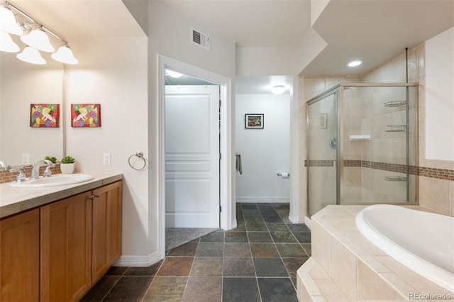 bathroom featuring vanity and plus walk in shower