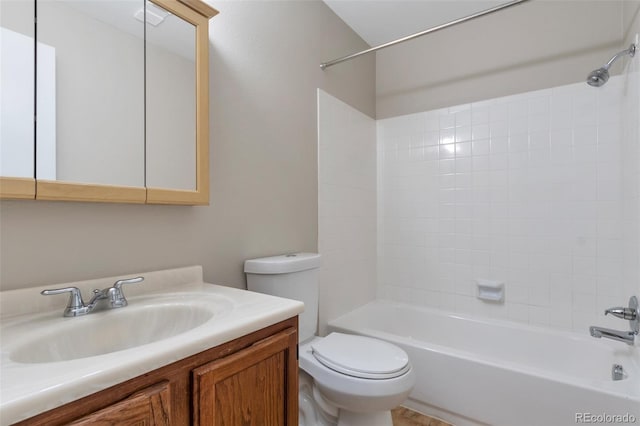 full bathroom featuring tub / shower combination, vanity, and toilet