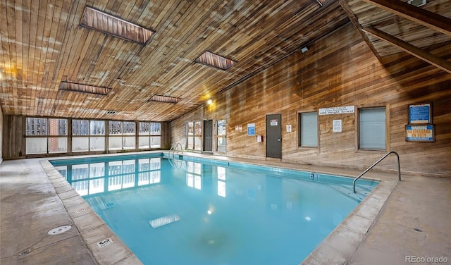 view of swimming pool with a skylight