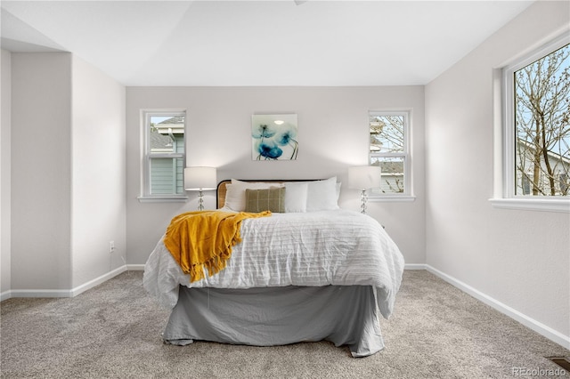 bedroom featuring carpet floors and baseboards
