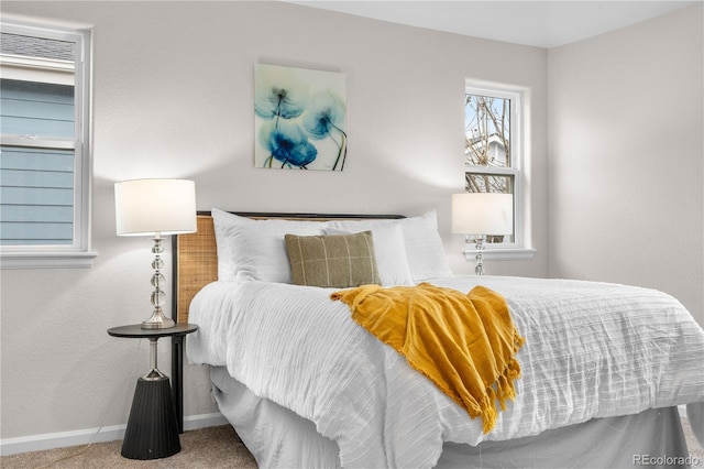 carpeted bedroom with baseboards