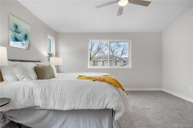 bedroom with multiple windows, carpet floors, baseboards, and ceiling fan