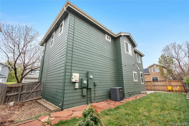 view of side of property featuring central AC unit