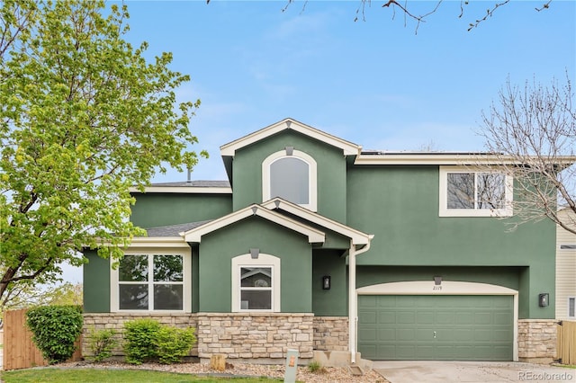 view of front facade featuring stone siding, stucco siding, a garage, and fence