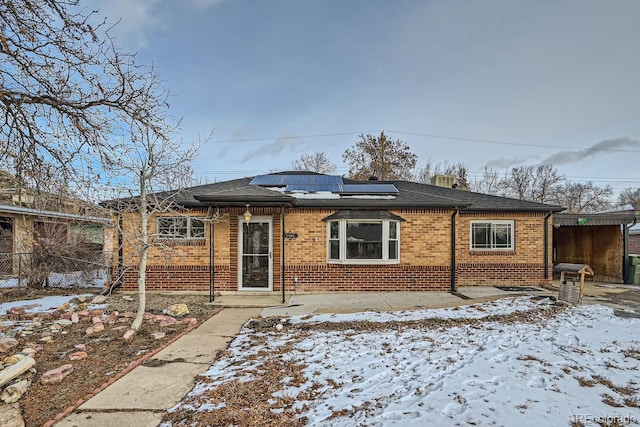 view of front of house featuring solar panels