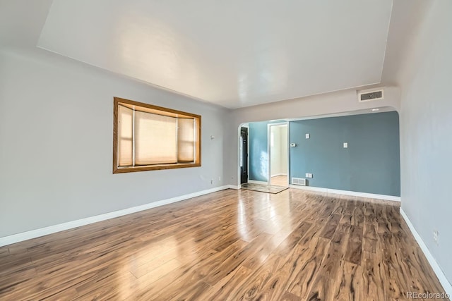 unfurnished room featuring wood-type flooring