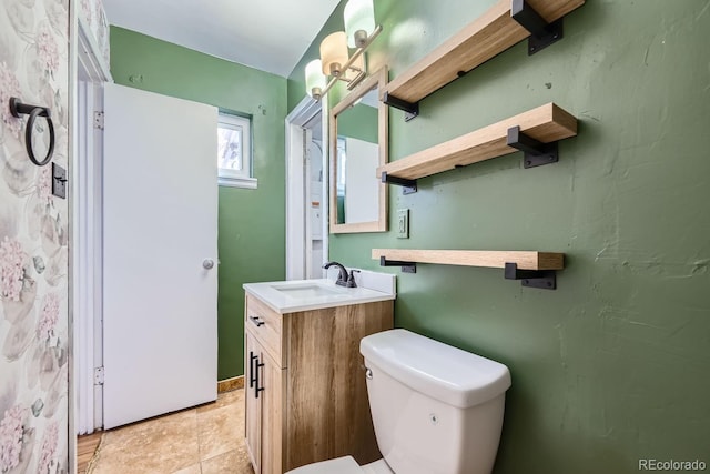 bathroom featuring tile patterned floors, vanity, and toilet