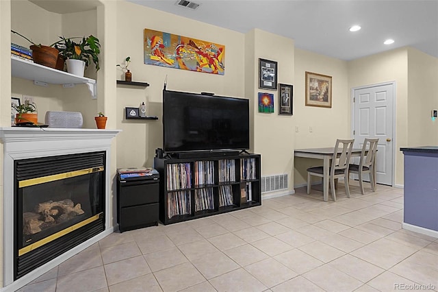 2143 Coronado Pkwy Unit C, Denver, CO 80229 - living room with a glass covered fireplace, recessed lighting, and light tile patterned floors