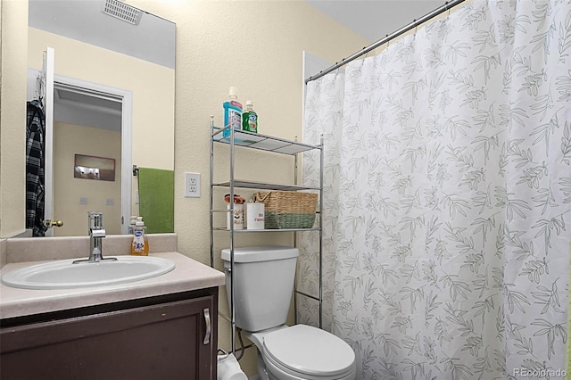 2143 Coronado Pkwy Unit C, Denver, CO 80229 - full bathroom featuring vanity, a textured wall, and a shower with curtain
