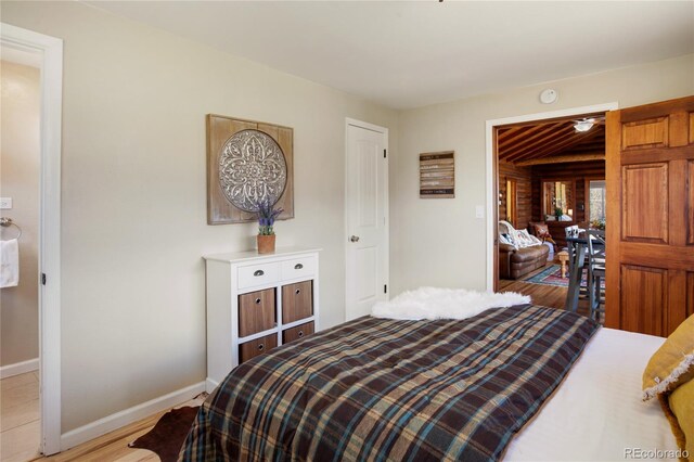 9850 Mohawk Trl, Cascade, CO 80809 - bedroom with light wood finished floors and baseboards