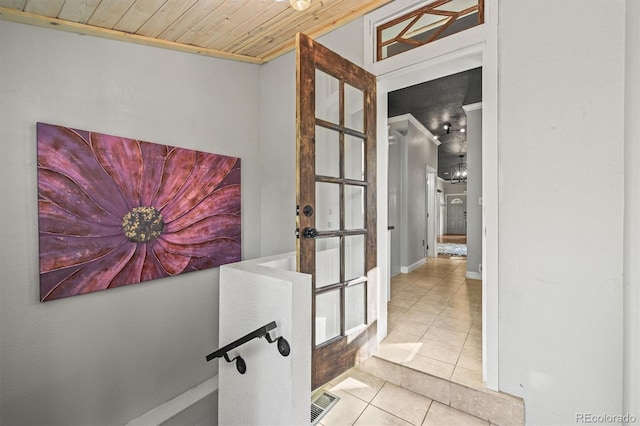 1024 34th St, Denver, CO 80205 - corridor featuring light tile patterned flooring, wooden ceiling, french doors, crown molding, and a chandelier